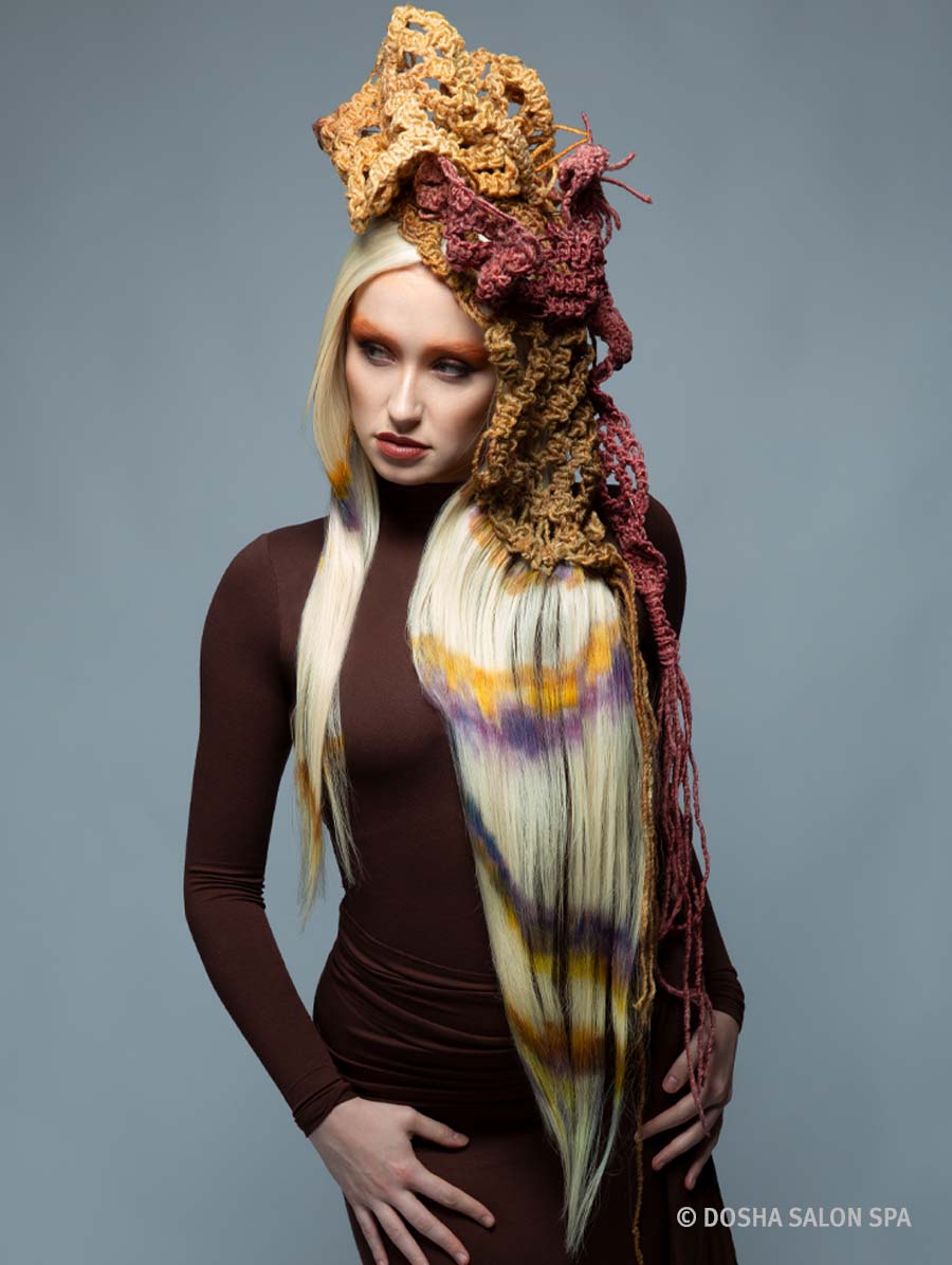 Image of a model with macrame hair and color inspired by the painted hills