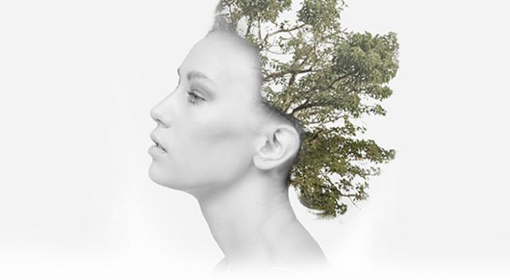 Image of Dosha Created Photoshoot for the Earth month. Model has a tree superimposed on her hair. Learn about Earth Month.